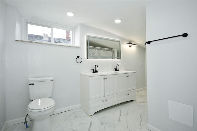 bathroom with a shower with shower curtain, vanity, toilet, and vaulted ceiling