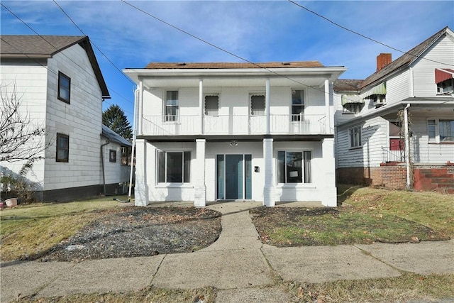 view of front of property with a balcony