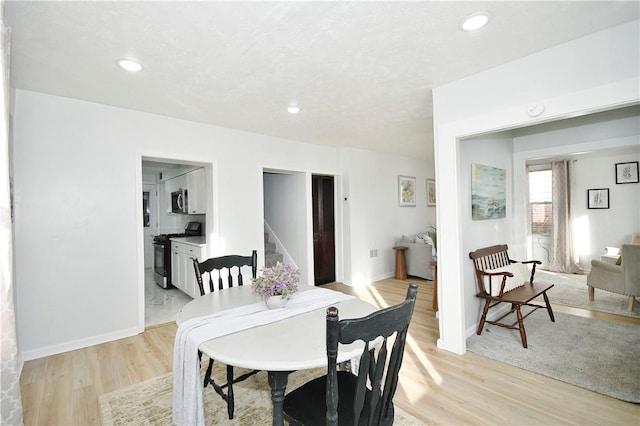 dining room with light hardwood / wood-style floors