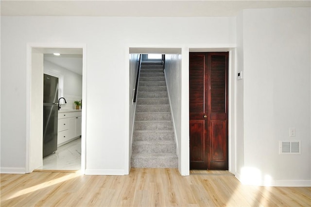 staircase featuring hardwood / wood-style floors