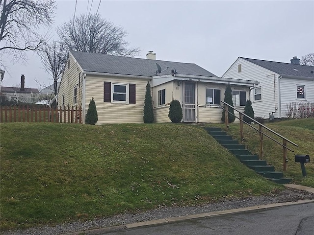 view of front of house with a front lawn