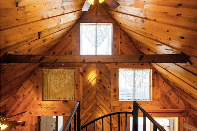 staircase featuring ceiling fan and wooden ceiling