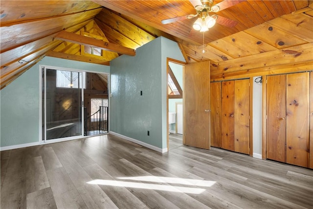 bonus room with light wood-type flooring, ceiling fan, lofted ceiling, and wood ceiling