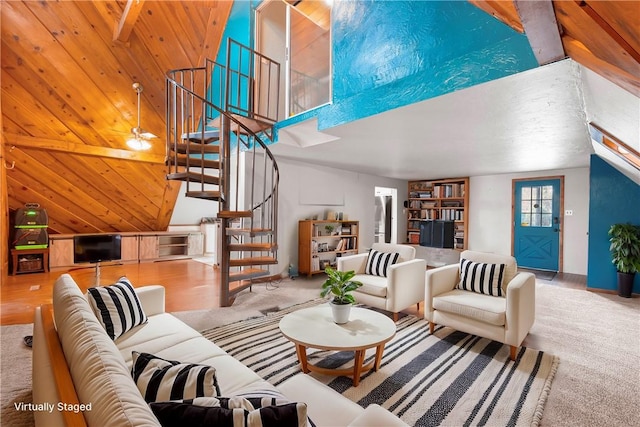 carpeted living room with ceiling fan, wooden ceiling, beamed ceiling, high vaulted ceiling, and wood walls