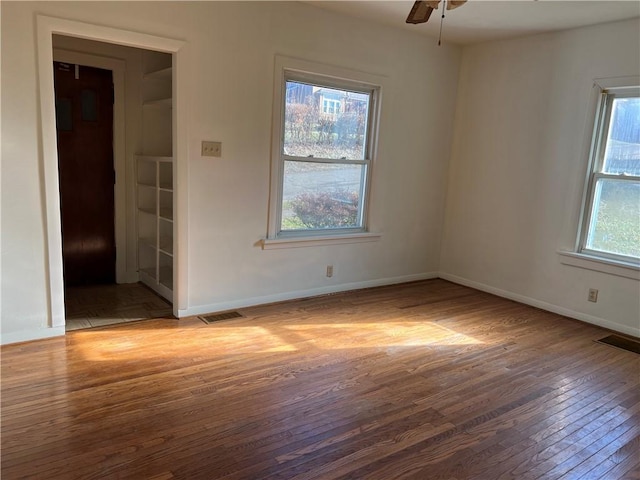 unfurnished room featuring ceiling fan and light wood-type flooring