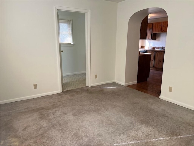 empty room with dark carpet