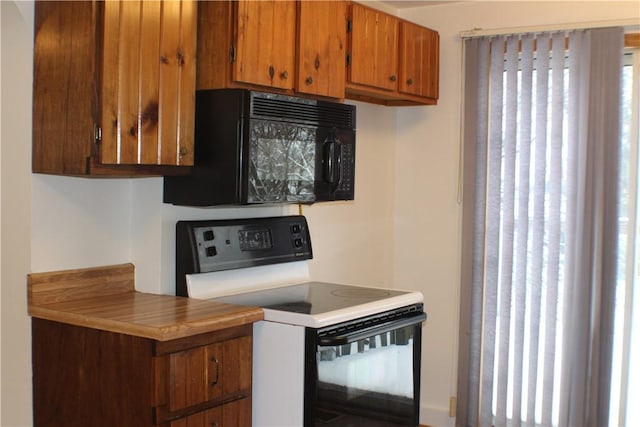 kitchen with white range with electric stovetop