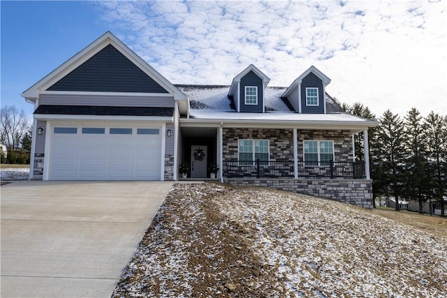 view of front of house with covered porch and a garage