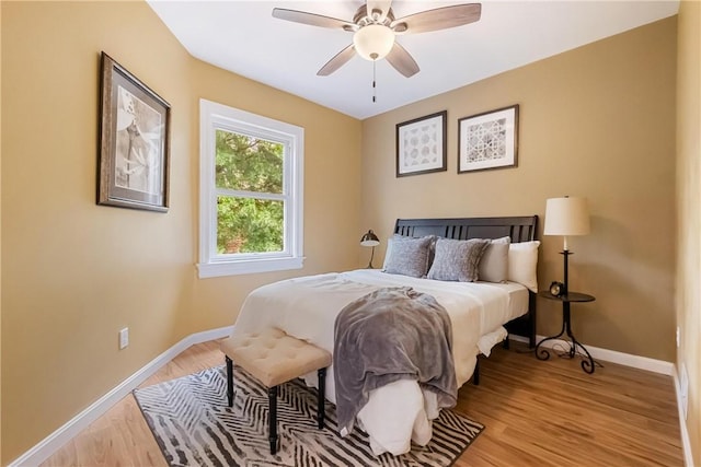 bedroom featuring light wood-type flooring and ceiling fan