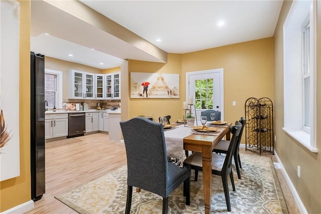 dining space with light hardwood / wood-style floors