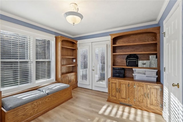 office featuring crown molding and light hardwood / wood-style flooring