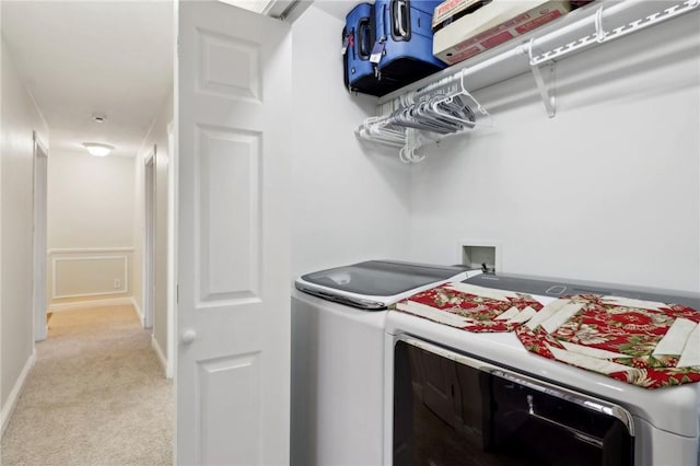 laundry room with light carpet and washing machine and clothes dryer