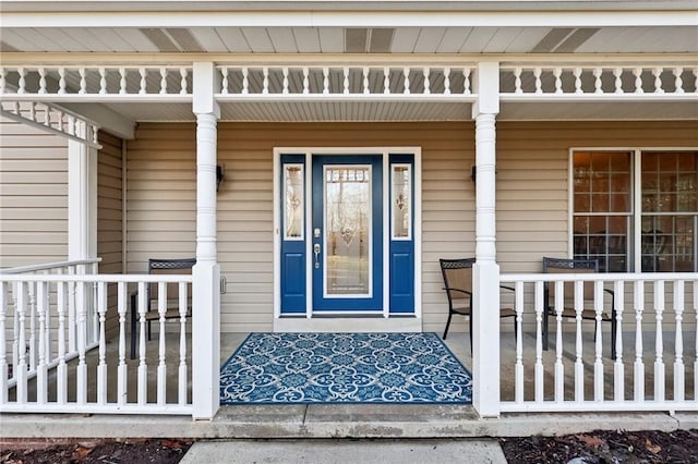 doorway to property with a porch