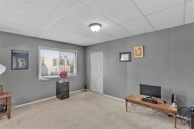 office area featuring a drop ceiling and light colored carpet