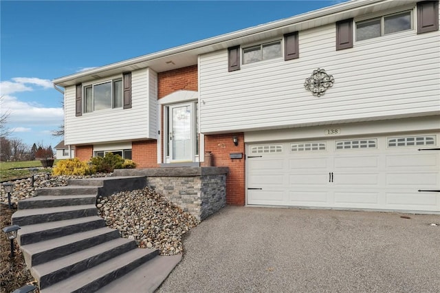 split foyer home featuring a garage