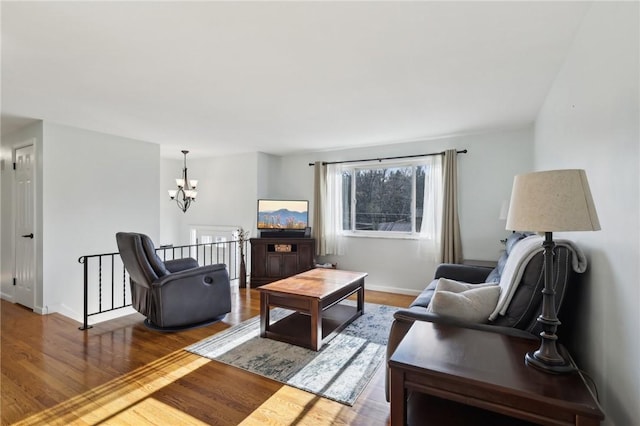 living room featuring hardwood / wood-style flooring and a chandelier