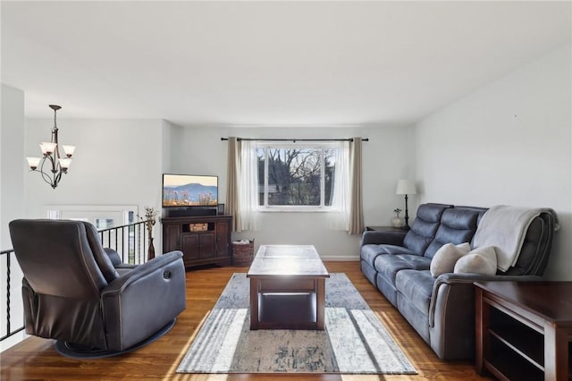 living room featuring a chandelier and hardwood / wood-style flooring