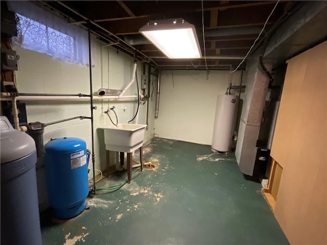 basement featuring water heater and sink