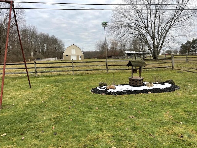 view of yard with a rural view