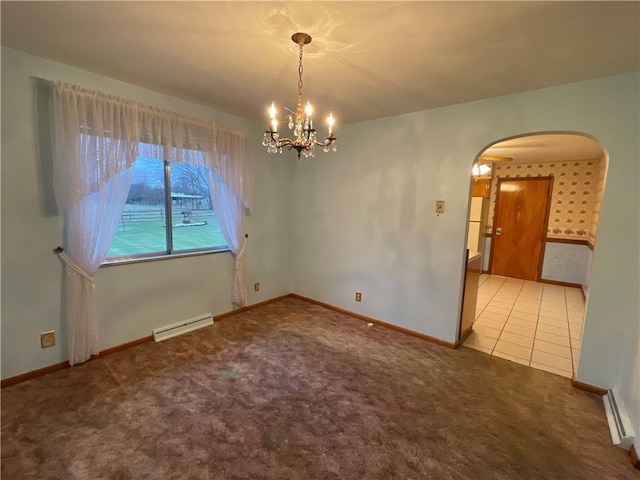 carpeted spare room with a baseboard heating unit and a notable chandelier