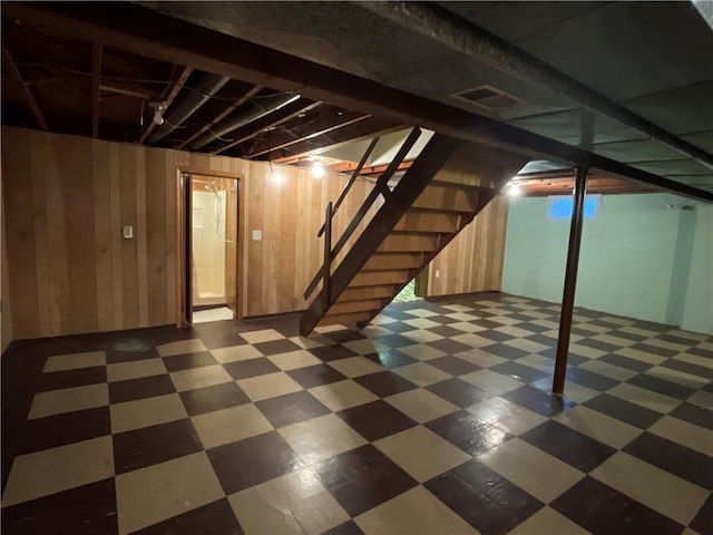 basement with wooden walls