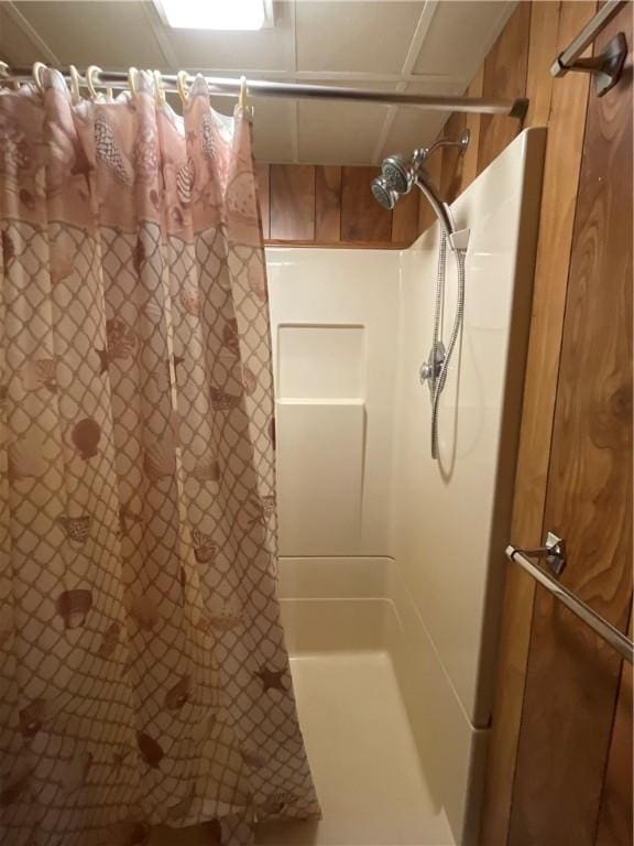 bathroom with a shower with shower curtain