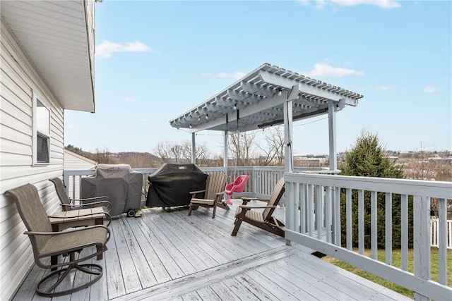 wooden terrace with a grill