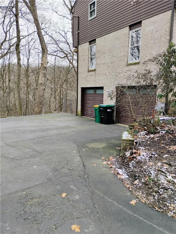 view of side of home featuring a garage