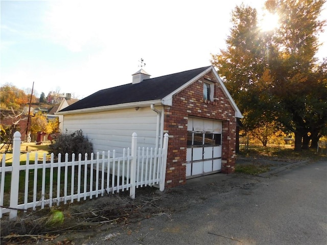 view of side of property with a garage