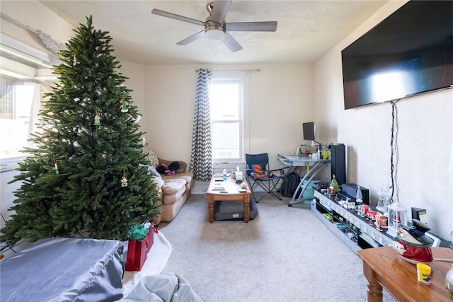 living room with carpet flooring and ceiling fan