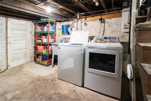 laundry room featuring washing machine and dryer and sink