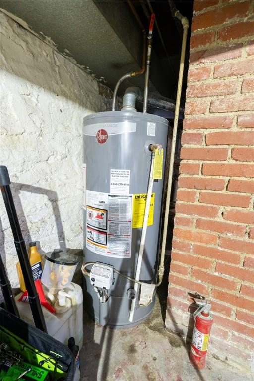 utility room featuring gas water heater