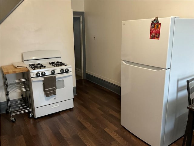 kitchen featuring butcher block countertops, dark hardwood / wood-style flooring, and white appliances