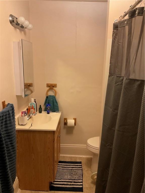 bathroom with tile patterned flooring, vanity, toilet, and a shower with shower curtain