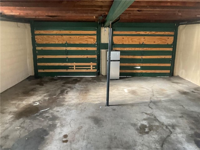 basement featuring white refrigerator