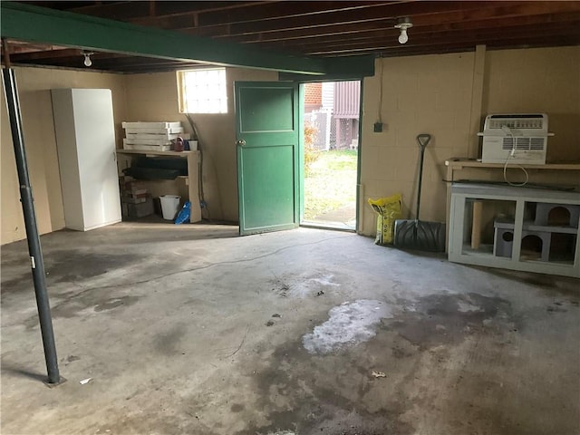 basement featuring a wall mounted AC