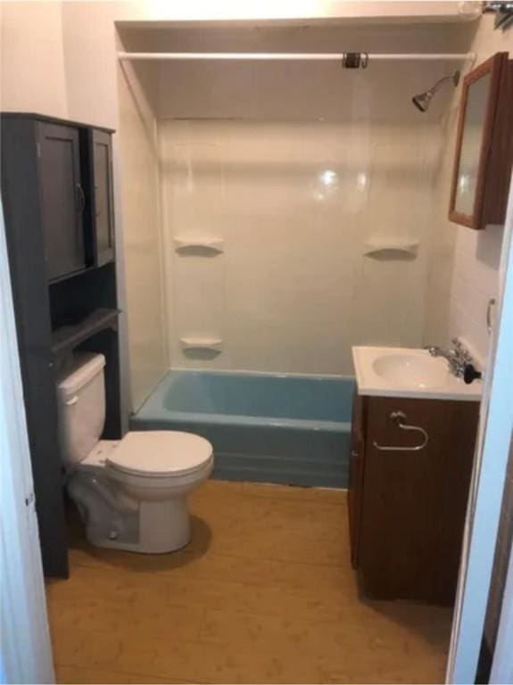 full bathroom with vanity,  shower combination, and toilet