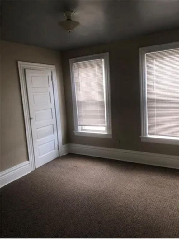 spare room featuring carpet flooring