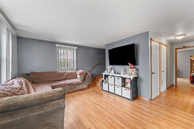 living room with light hardwood / wood-style floors