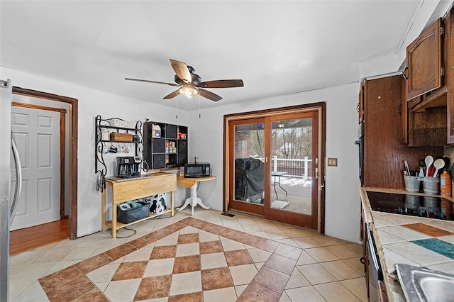 interior space with ceiling fan and sink