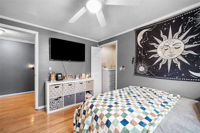 bedroom featuring ceiling fan, crown molding, and light wood-type flooring