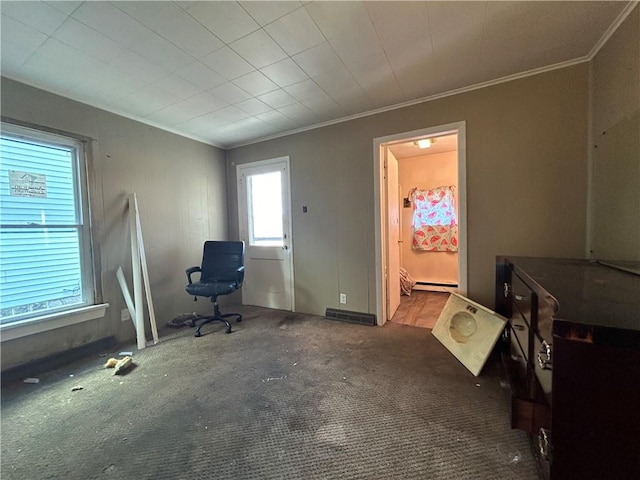 carpeted home office with ornamental molding and baseboard heating