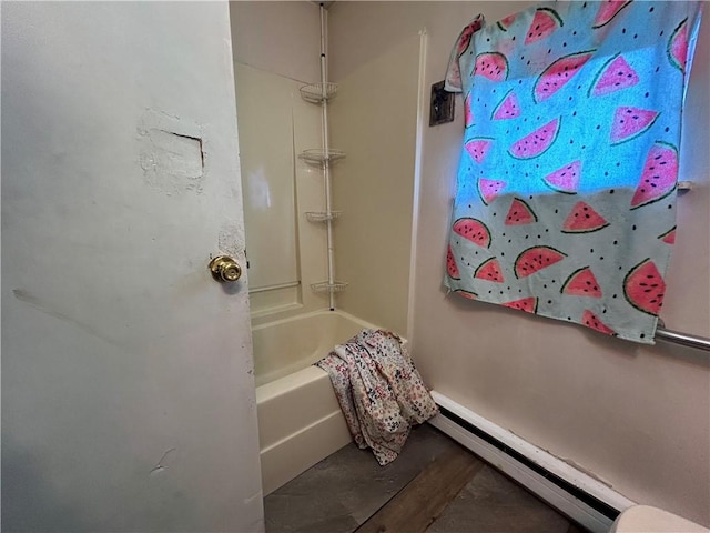 bathroom featuring  shower combination and a baseboard radiator