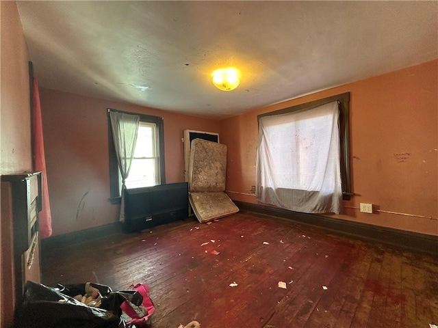 unfurnished room featuring dark hardwood / wood-style flooring