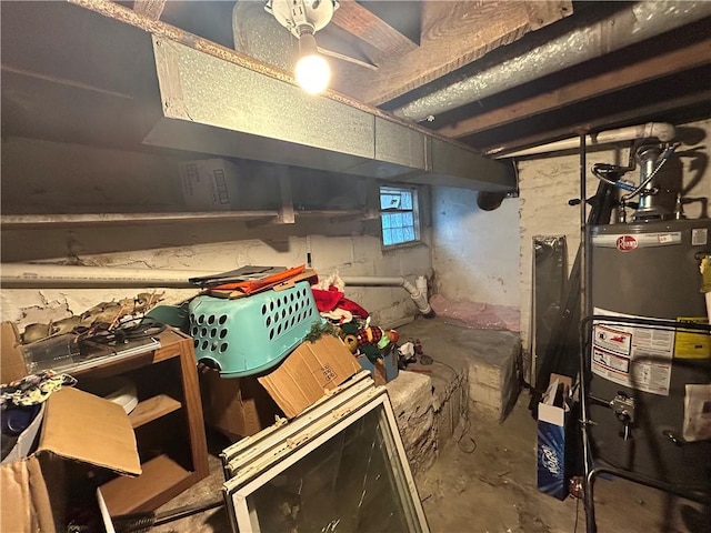 basement with ceiling fan and water heater