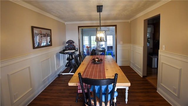 dining room featuring a chandelier, dark hardwood / wood-style floors, and ornamental molding