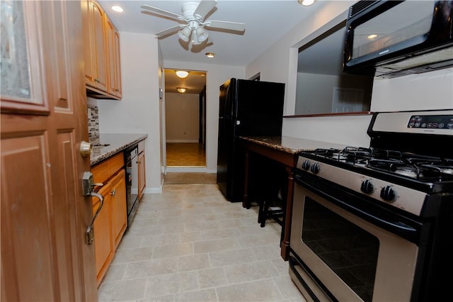 kitchen with light stone counters, ceiling fan, and black appliances