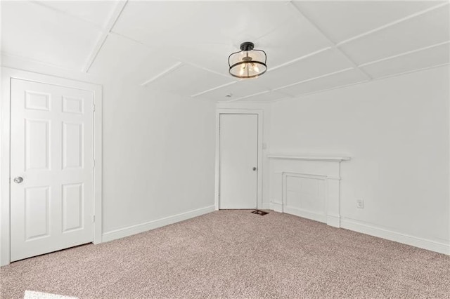 unfurnished room featuring carpet floors and a paneled ceiling