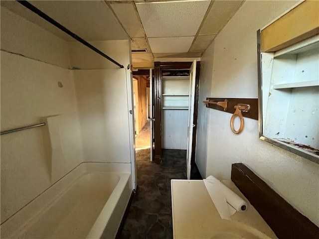 bathroom with a paneled ceiling