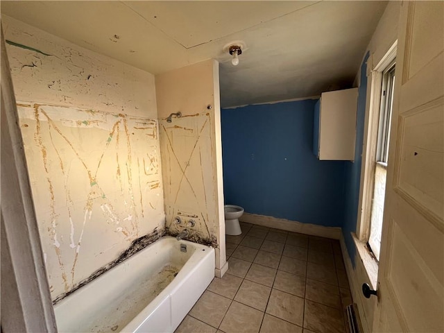 bathroom with tile patterned floors, toilet, and tub / shower combination